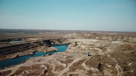 Opencast mining quarry with machinery at work - Aerial view. Vídeos de archivo 182978413