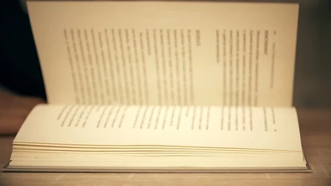 Opened aged book with browsing paper pages Video stock 88318152