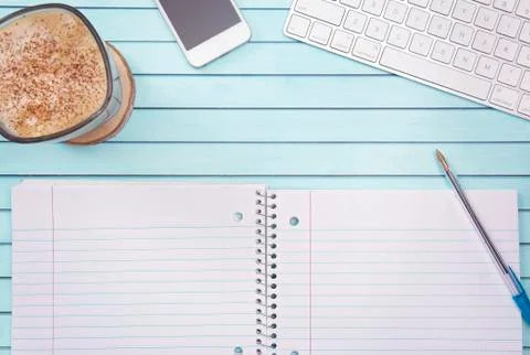 Opened Blank Notebook on a Desk with Computer Keyboard Smart Phone and Cup of Stock Photos