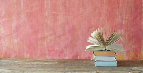 Opened book and stack of book,reading,education,home office, back to school Stock Photos