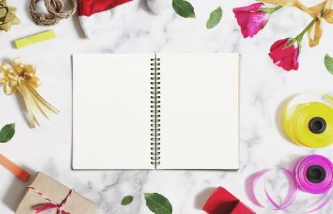 Opened book with empty white paper on white marble desk Stock Photos