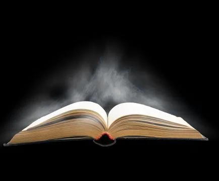 Opened book with magic light Stock Photos