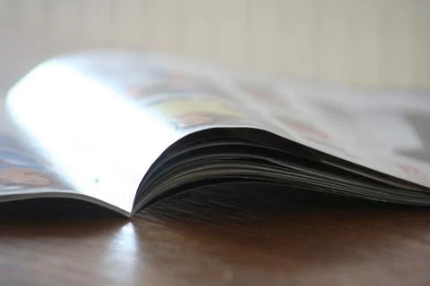 Opened book with reflection seeing the left side of Stock Photos