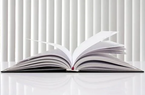 Opened book with reflection on white education concept. opened book with r... Stock Photos