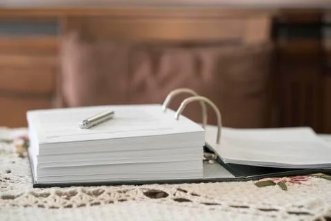 An opened book on a table, indoor Foto stock