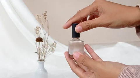 Opened a bottle of gold nail polish Stock Footage 137212236