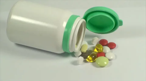 Opened Bottle Of Pills On A White Background, Medical, Medicine, Cure, Treatment Stock Footage 39351528