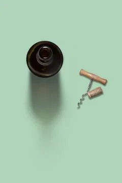 Opened bottle of wine with corkscrew and cork. Stock Photos