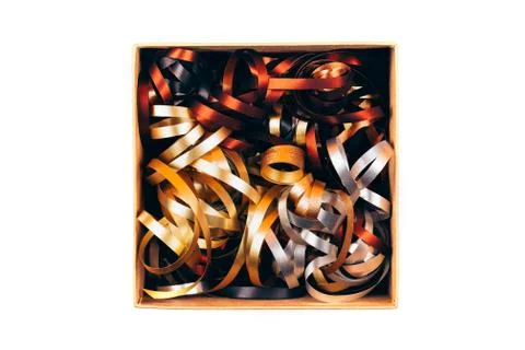Opened box with twisted ribbons Stock Photos