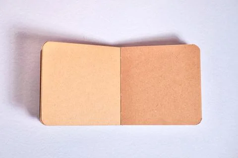Opened brown blank sketch book top angle Stock Photos