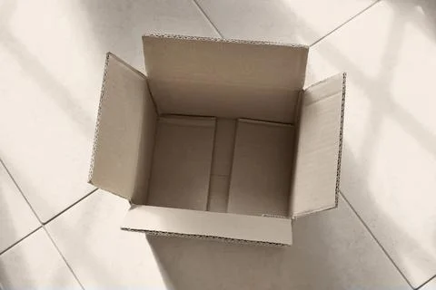 Opened brown cardboard box Stock Photos