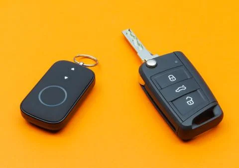 Opened Car Key with Remote Control on an orange background 写真素材