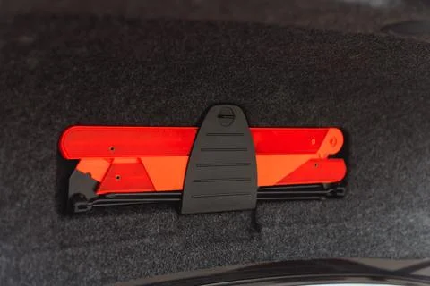 Opened Car Trunk Lid with Folded Emergency Stop Sign Stock Photos