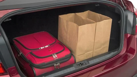 Opened car trunk with luggage and bags Red 2018 Subaru Legacy 3.6R Limited Stock Footage 159928489