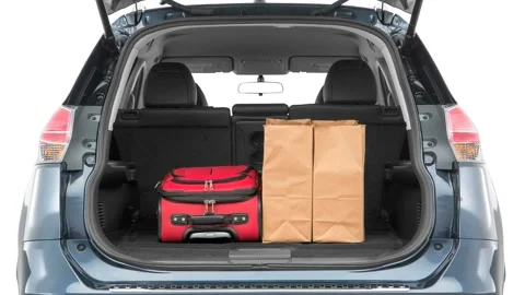 Opened car trunk with luggage Arctic Blue Metallic 2016 Nissan Rogue SL Stock Footage 159859385
