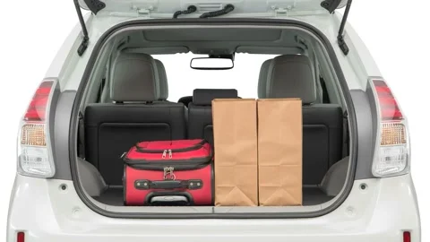 Opened car trunk with luggage Blizzard Pearl 2017 Toyota Prius V Five Stock Footage 159900979