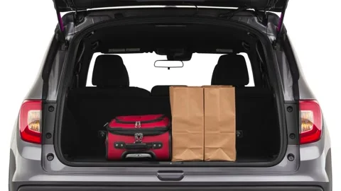Opened car trunk with luggage Modern Steel Metallic 2019 Honda Passport Sport Stock Footage 160085669