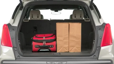 Opened car trunk with luggage Silver Coast Metallic 2017 Cadillac XT5 Stock Footage 159892585