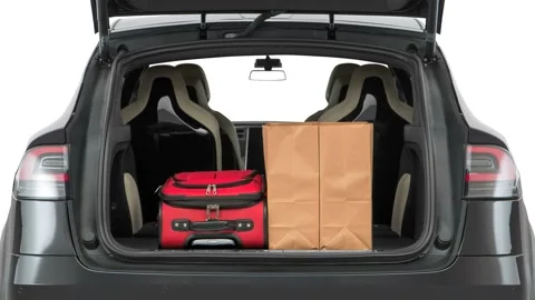 Opened car trunk with luggage Solid Black 2016 Tesla Model X P90D Stock Footage 159889366