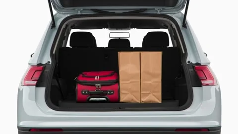 Opened car trunk with luggage White Silver Metallic 2018 Volkswagen Tiguan S Video stock 159972263
