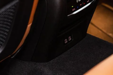 Opened car USB type C port in the car for connecting device. Power output of  Stock Photos