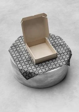 Opened Cardboard box on the table with a square tablecloth Ilustração Stock