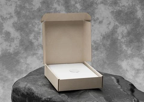 Opened cardboard box on top of black rock with texture use for mockup Stock Illustration