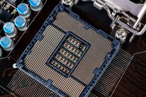 Opened central processor LGA slot on pc mainboard - closeup shot with selective Stock Photos