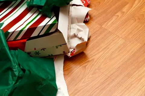Opened christmas gift boxes and wrapping paper Stock Photos
