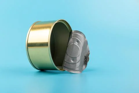 Opened clean tin can with pull tab ring, bended lid and empty - isolated on b Stock Photos