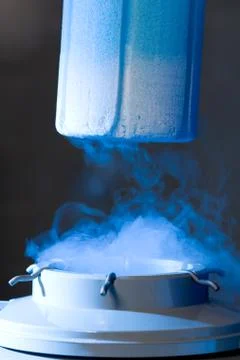 Opened container with liquid nitrogen, blue light Stock Photos