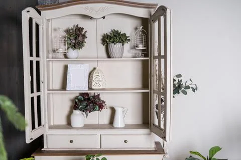 Opened cupboard with kitchenware inside Stock Photos