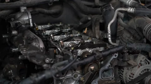 An opened cylinder head of an internal combustion engine exposes camshafts, a Stock Footage 345110304