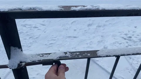 Opened the door, the man opened the gate in winter Stock Footage 167537278
