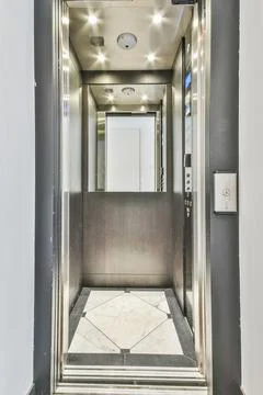 Opened doors of elevator in modern building Fotos de archivo