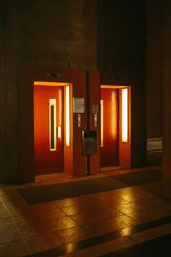 Opened doors in elevators with glowing lamps 写真素材