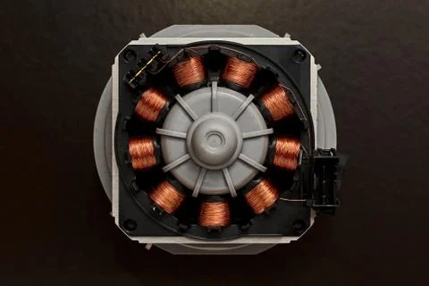 Opened electro motor with a copper coil and wire winding Stock Photos