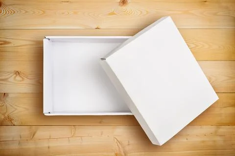Opened empty cardboard box with cover Stock Photos