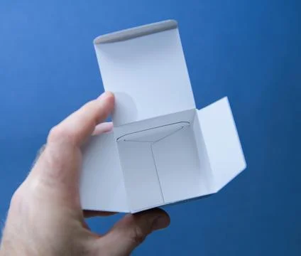 Opened Empty White Cardboard Box in Hand Stock Photos