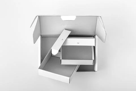 Opened empty white packaging boxes with different size, top view Stock Photos