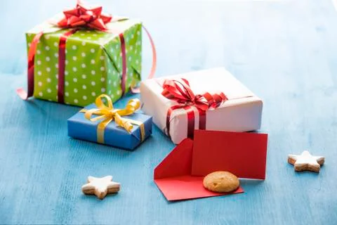 Opened envelope and gifts Stock Photos