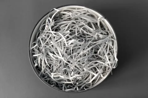 Opened gift box with decorative straw, filler, shavings, paper ribbons. Cut p Stock Photos