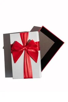 Opened gift box with lid and red ribbon isolated on white Stock Photos