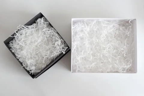 Opened gift boxes with decorative straw, filler, shavings. paper box for your Stock Photos