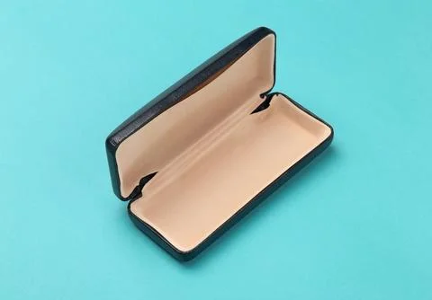 Opened Glasses box isolated on light blue background Stock Photos