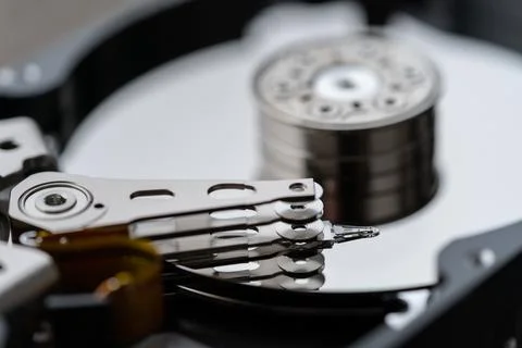 Opened hard disk after disassembly during repair or service, macro shot Stock Photos