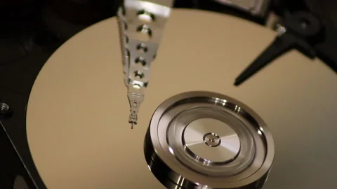 Opened Hard Disk Drive with spinning platter. Detail of working process Stock Footage 130946169