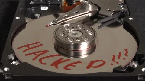 Opened hard drive with flashing light effects, HACKED written on the surface Stock Footage 320836065