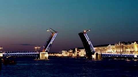 Opened illuminated Palace Bridge on the Neva river in the night Stock Footage 150987586