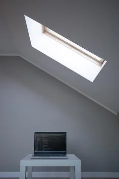 Opened laptop with code on the screen on the table Stock Photos